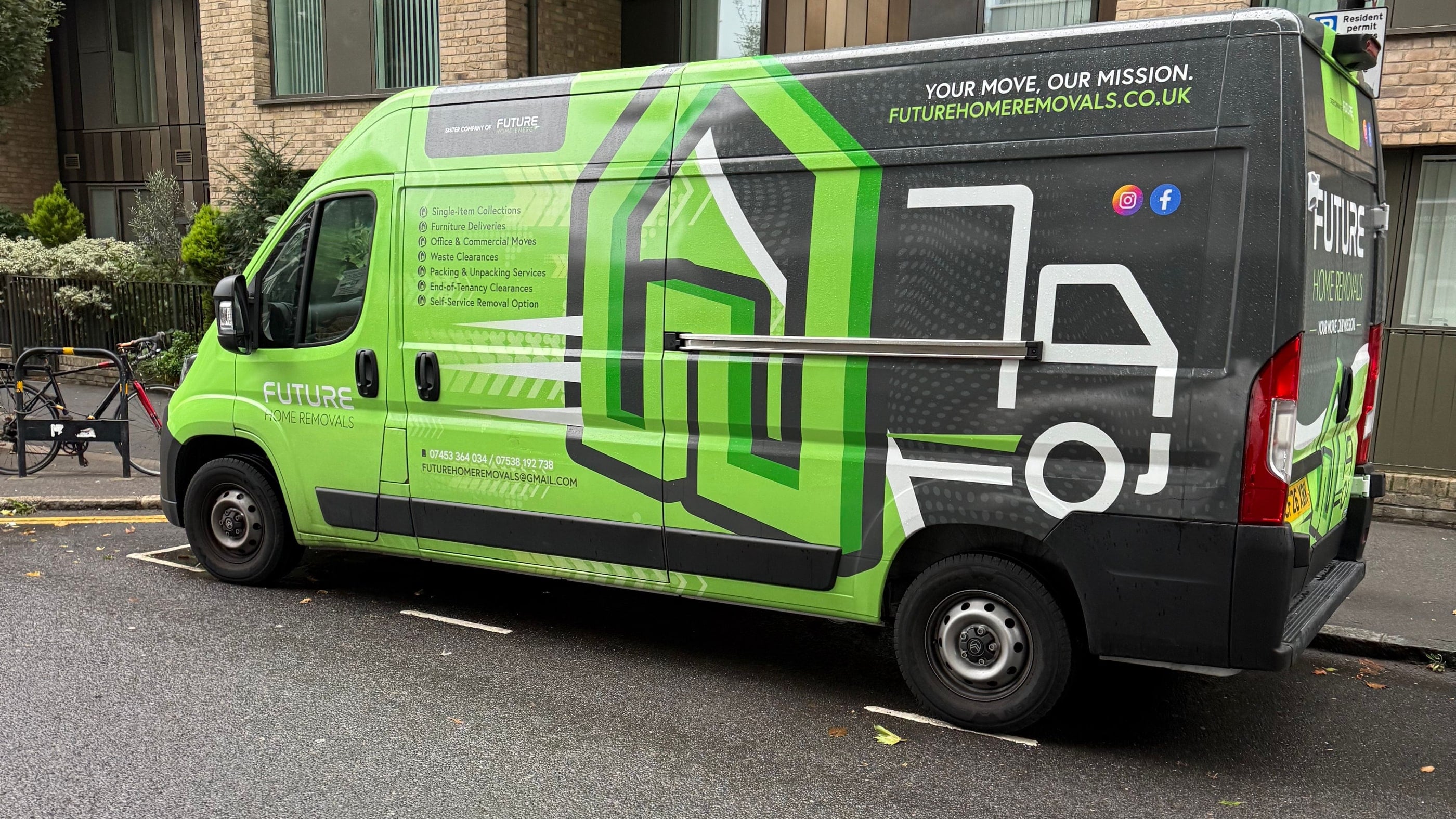 The green Future Home Removals van parked on a London street